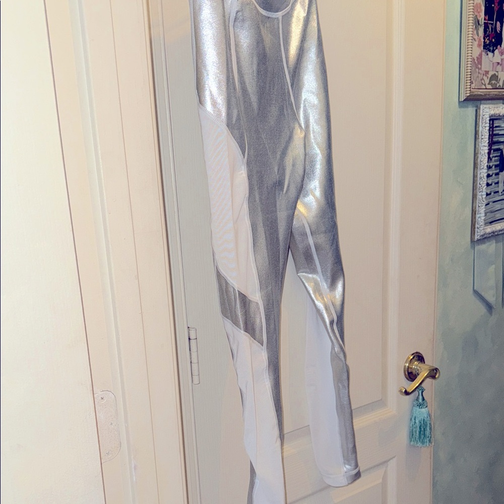 Silver foil workout leggings with white mesh insert size small. From France.